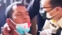 Foto: Video viral petugas swab test mencium pria yang dilayaninya. (dok. Istimewa)